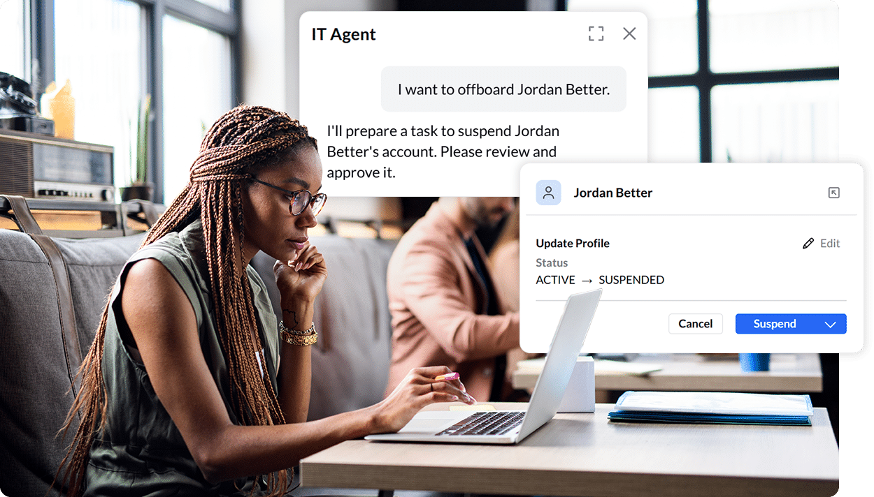 Woman at office desk using a laptop, with on-screen pop-ups indicating an IT agent suspending user profile "Jordan Better.